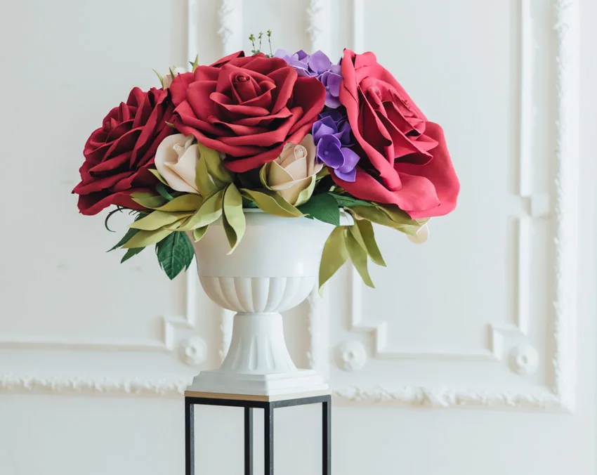 pedestal vase with flowers for home interiors
